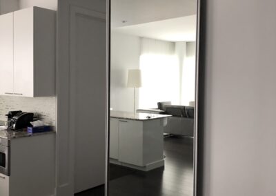 Mirrored wall slide door for room separation