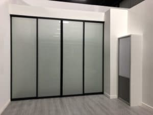 Frosted glass sliding doors with mat black framing