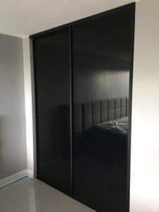 pure black glass and mat black framing sliding doors