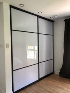 white acrylic and mat black framing closet doors