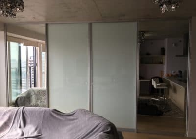 white glass and mirror room separating sliding doors